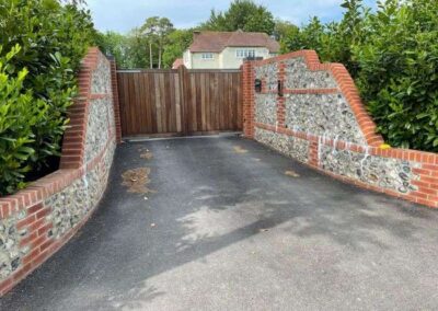 Brick wall by gateway entrance